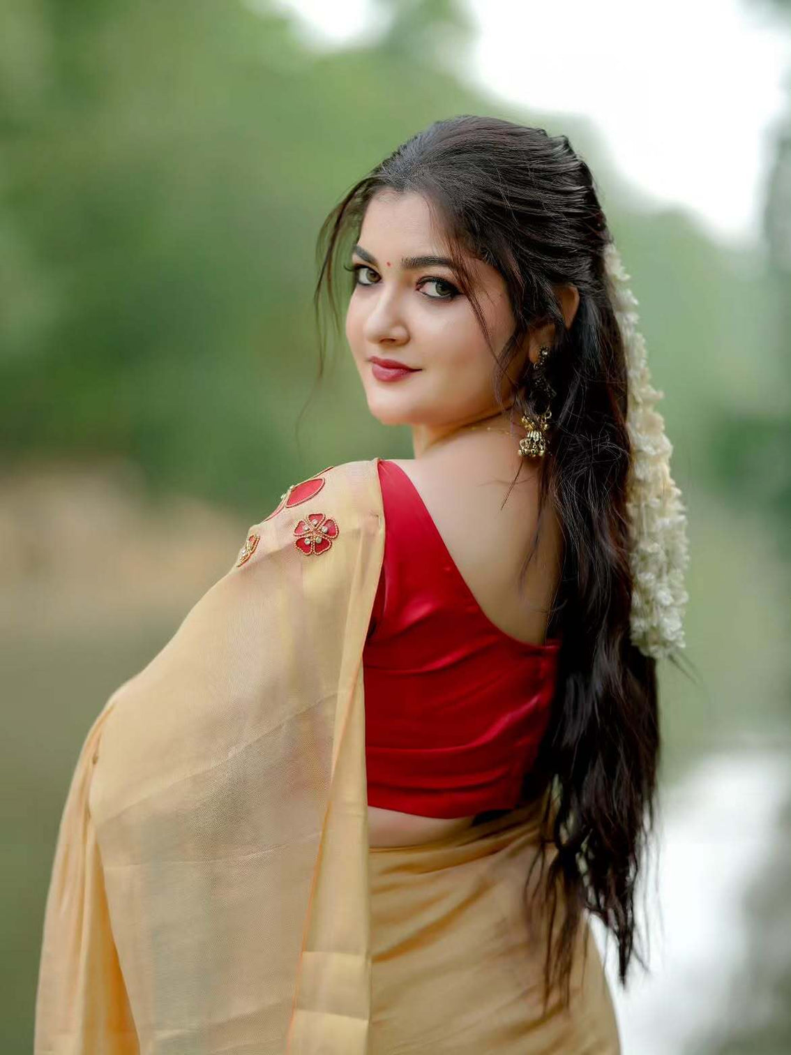 Golden tissue handwork saree with designer floral blouse