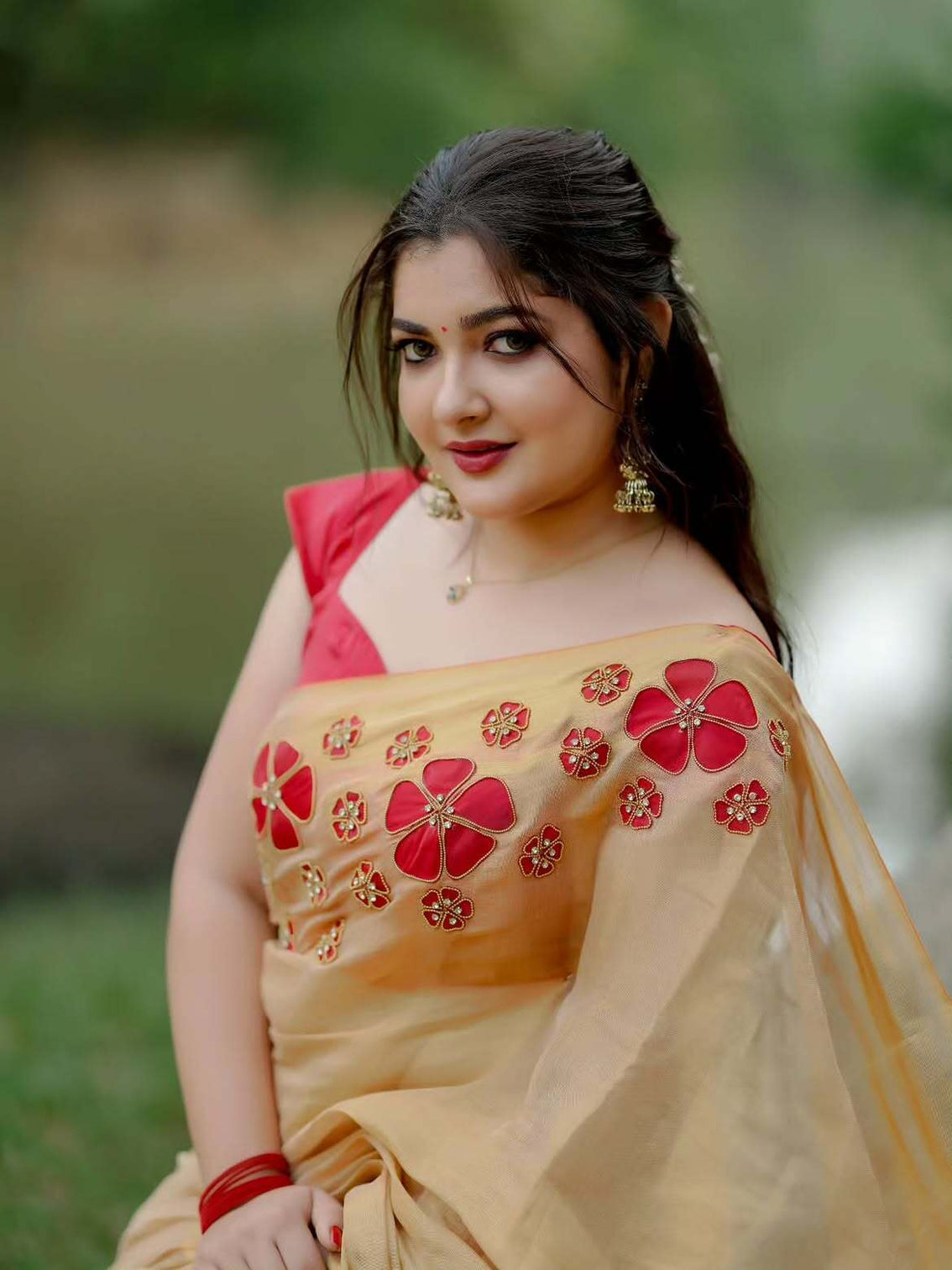 Golden tissue handwork saree with designer floral blouse