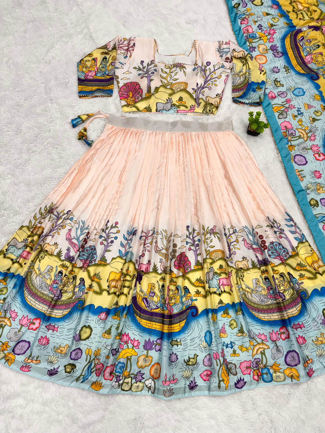 Cream and mustard kalamkari lehenga with pastoral motif and blue border