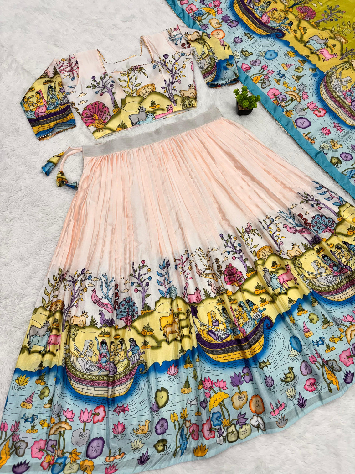 Cream and mustard kalamkari lehenga with pastoral motif and blue border