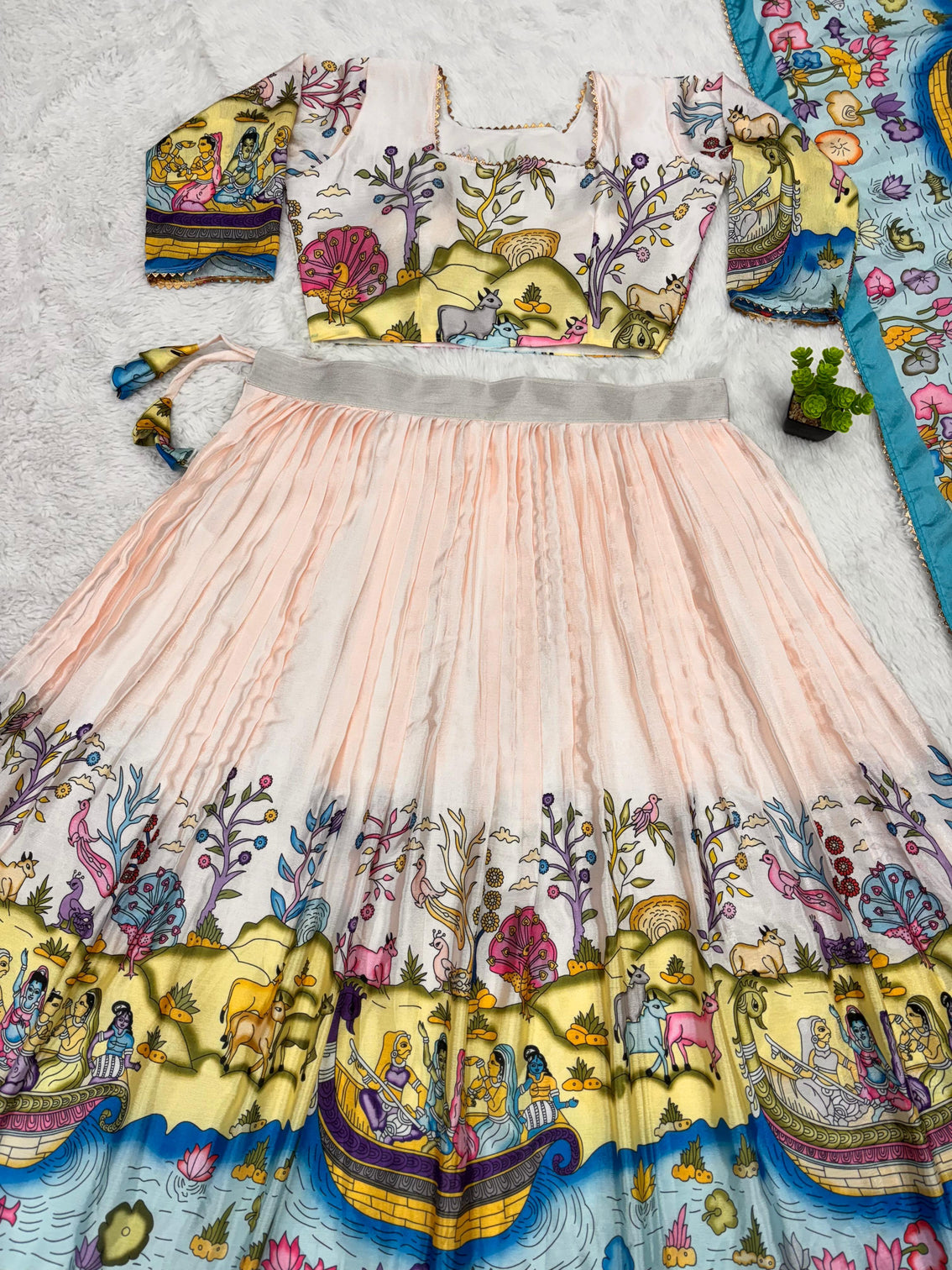 Cream and mustard kalamkari lehenga with pastoral motif and blue border