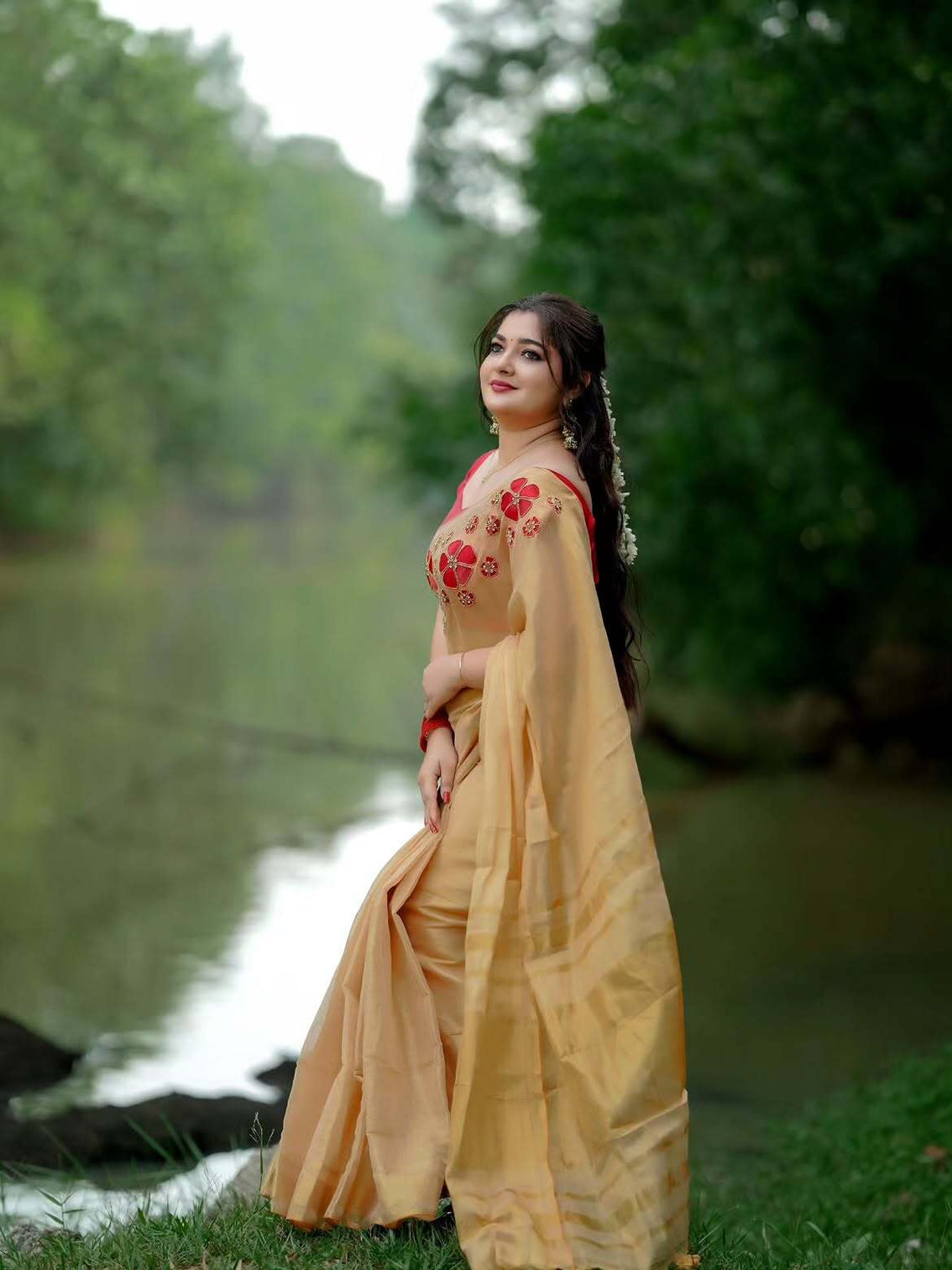 Golden tissue handwork saree with designer floral blouse
