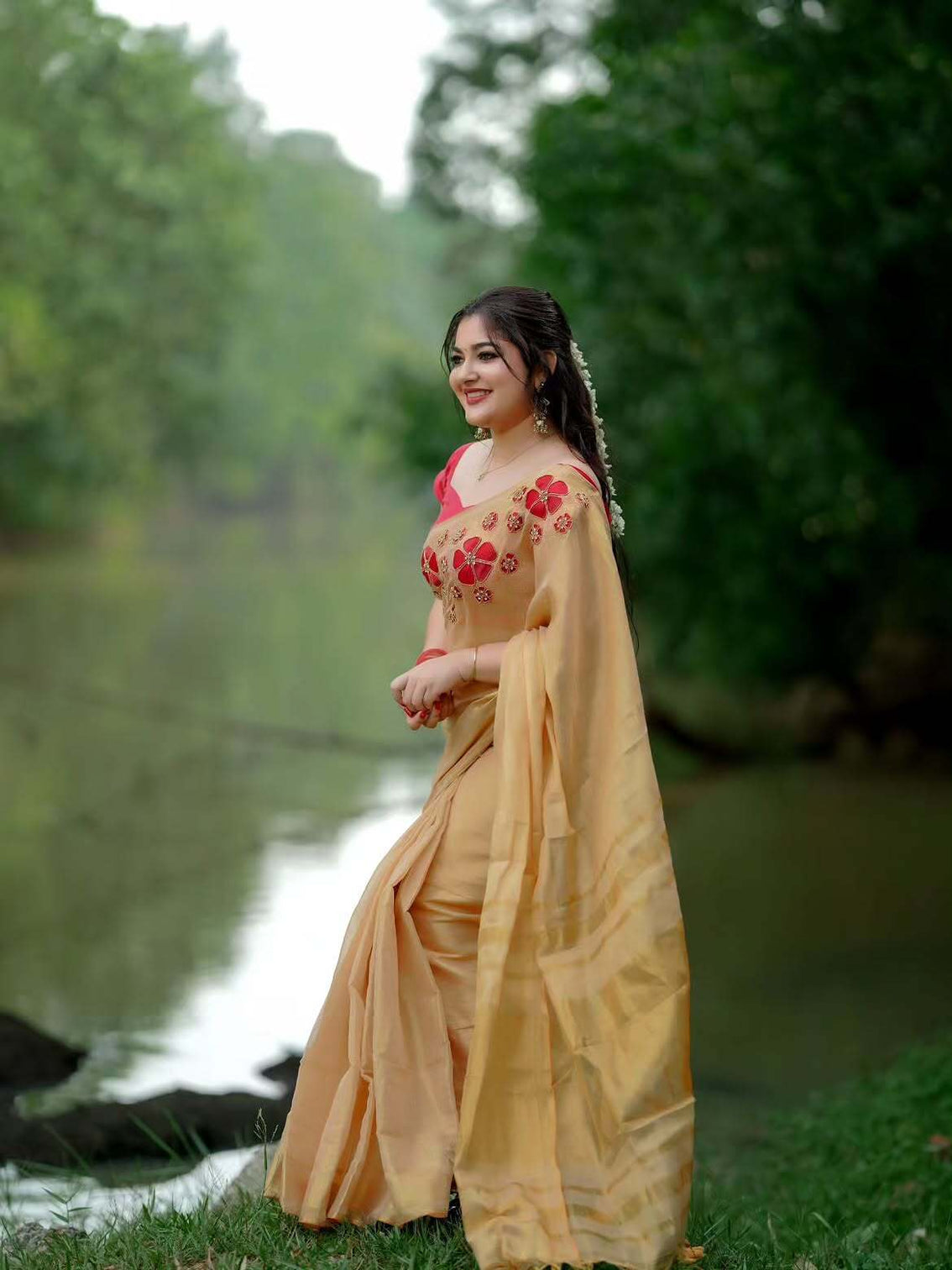 Golden tissue handwork saree with designer floral blouse