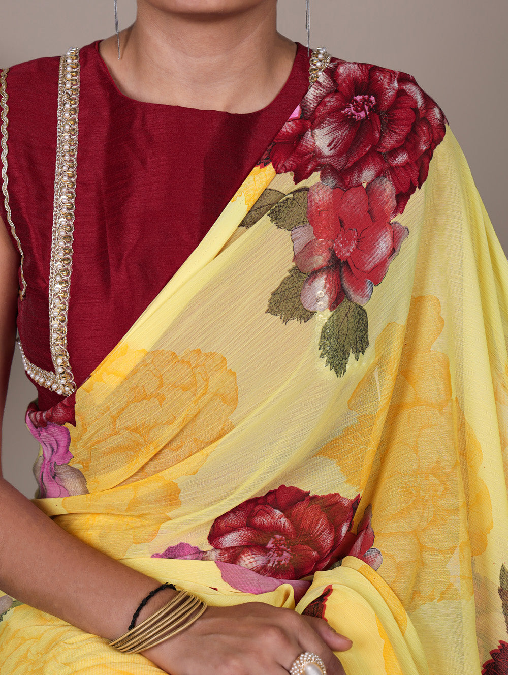 Yellow floral print chiffon saree with red banglory blouse lace border