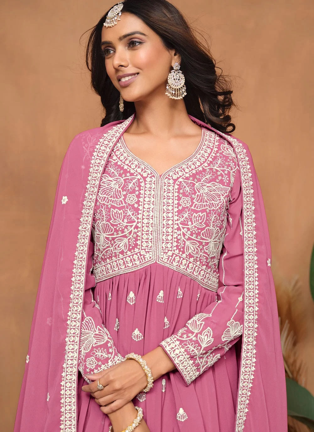 Beautiful pink faux georgette sharara suit with santool inner