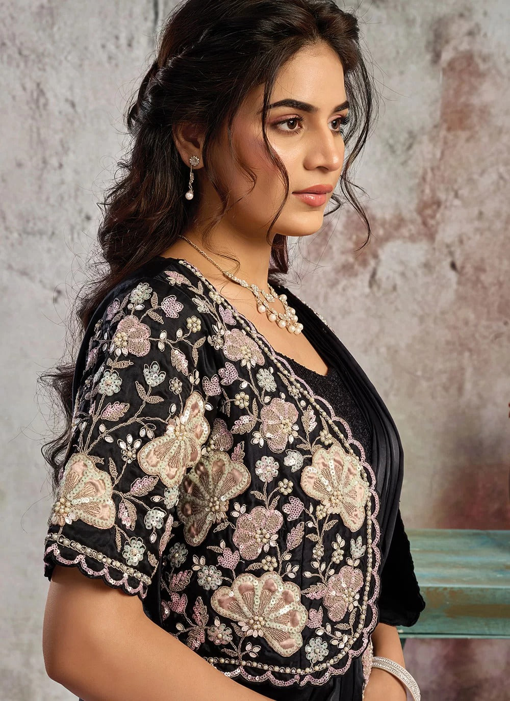 Black ready to wear saree in lustrous satin with applique stone work