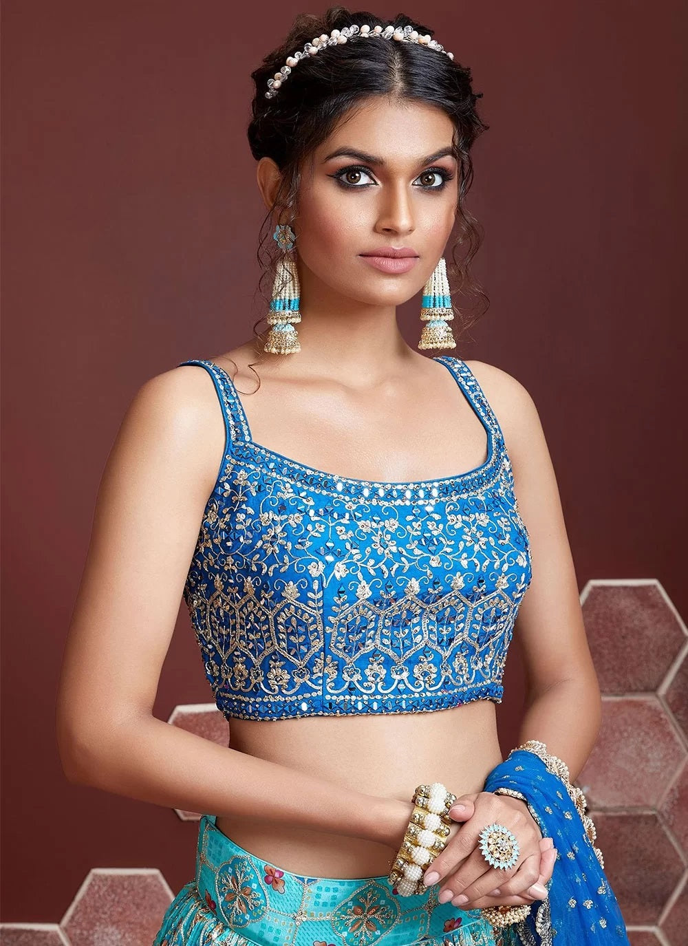 Blue and gold embroidered lehenga with shoulder strap neck blouse