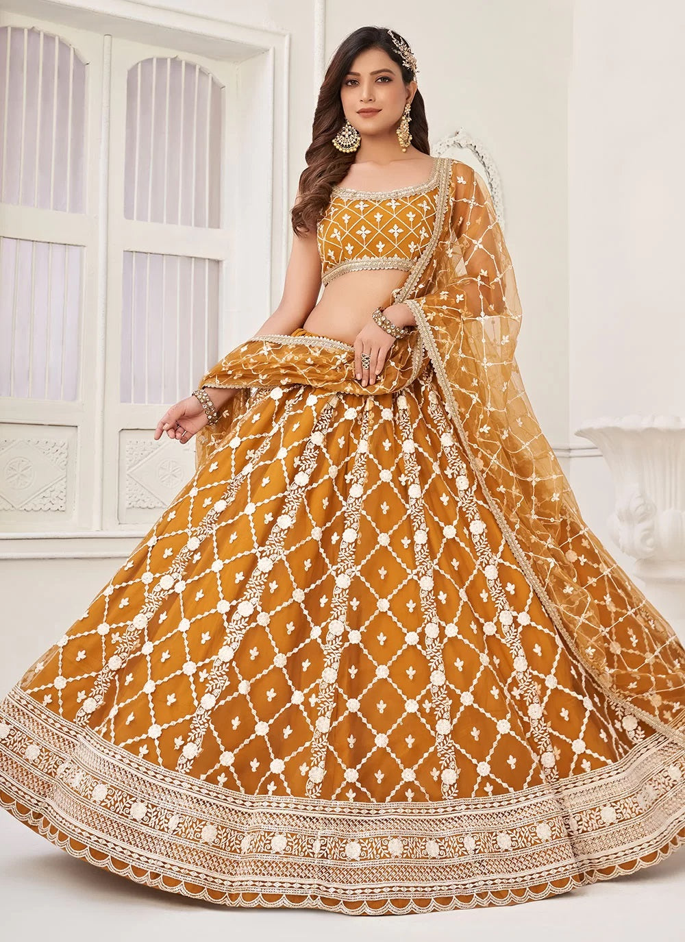 Brown net embroidered haldi wear lehenga choli