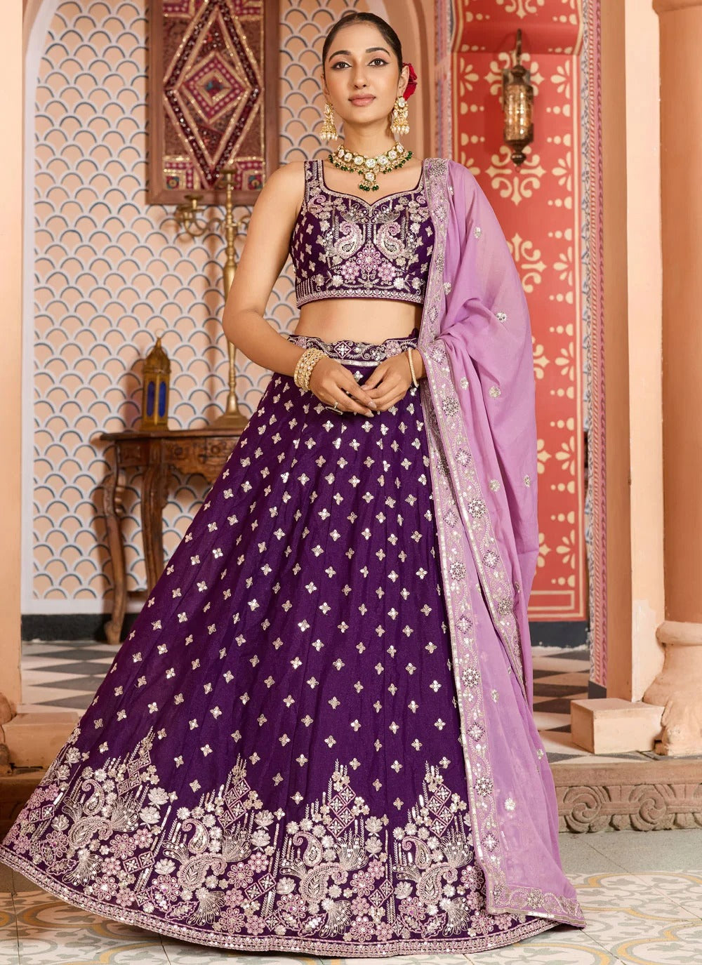 Opulent burgundy engagement lehenga in tissue silk with zari sequins embroidery