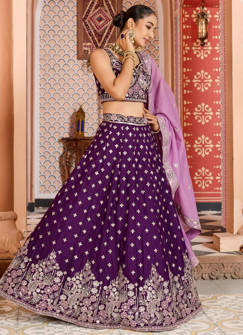 Opulent burgundy engagement lehenga in tissue silk with zari sequins embroidery