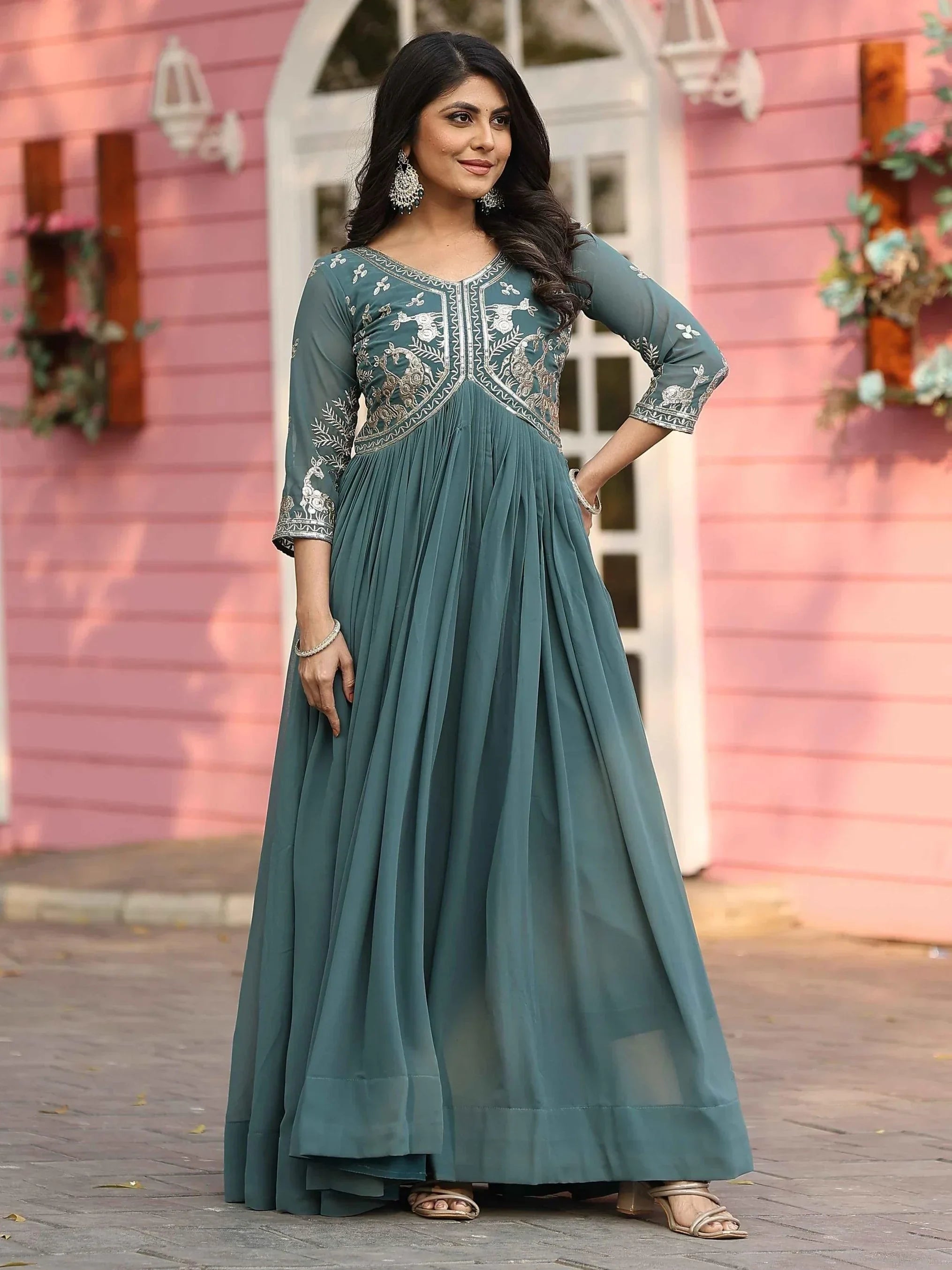 Captivating Teal Green Sequins Work Georgette Festive Wear Gown