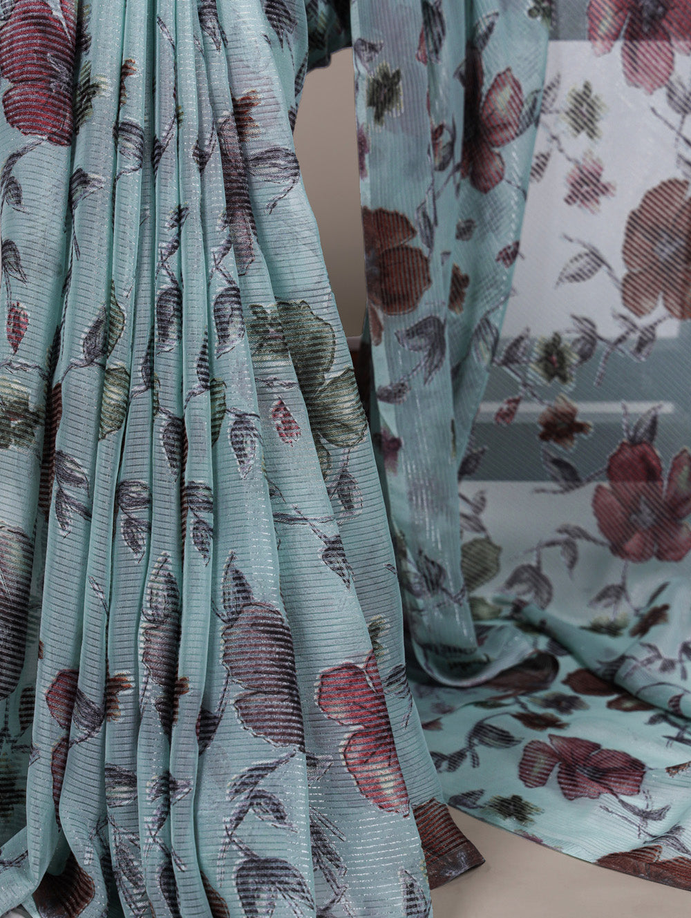 Sea green floral lurex brasso saree with natural silk blouse