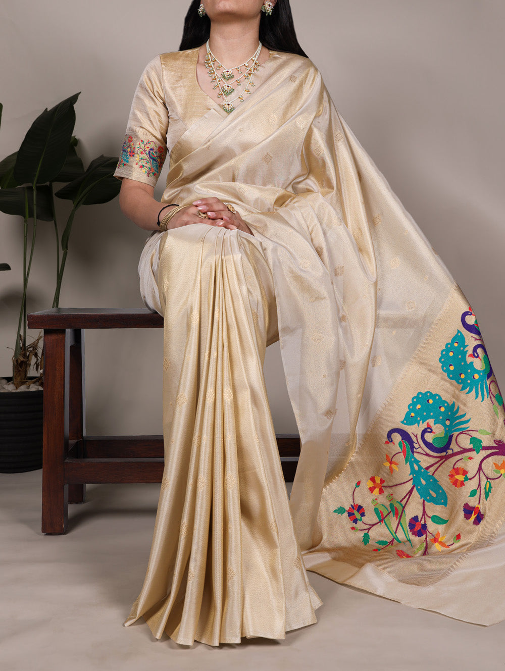 Cream tissue paithani saree with intricate zari weaving unstitched blouse