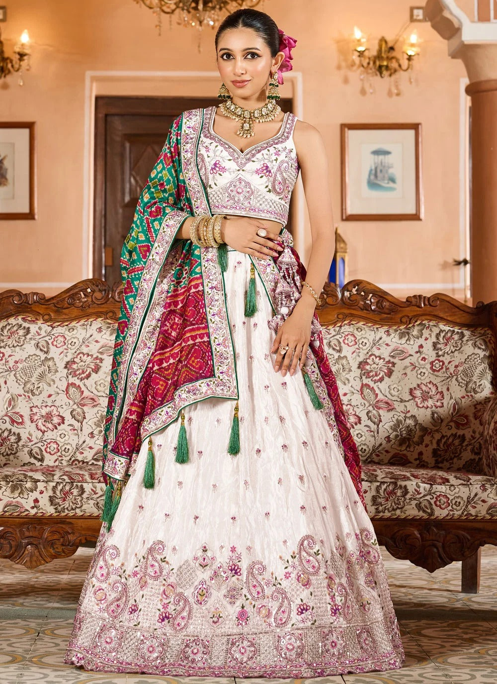 Exquisite cream engagement lehenga in tissue with patola dupatta zari embroidery