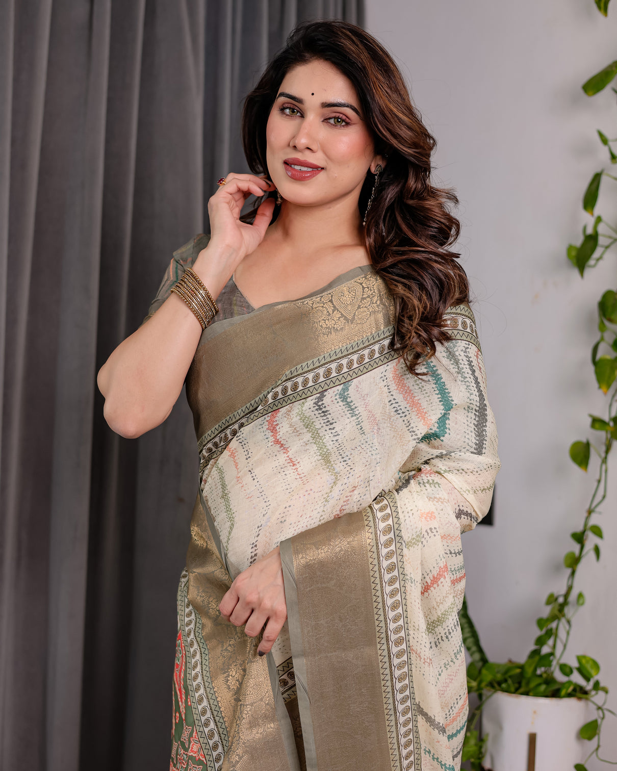 Elegant cream gold woven ikat silk saree with designer border with tassles