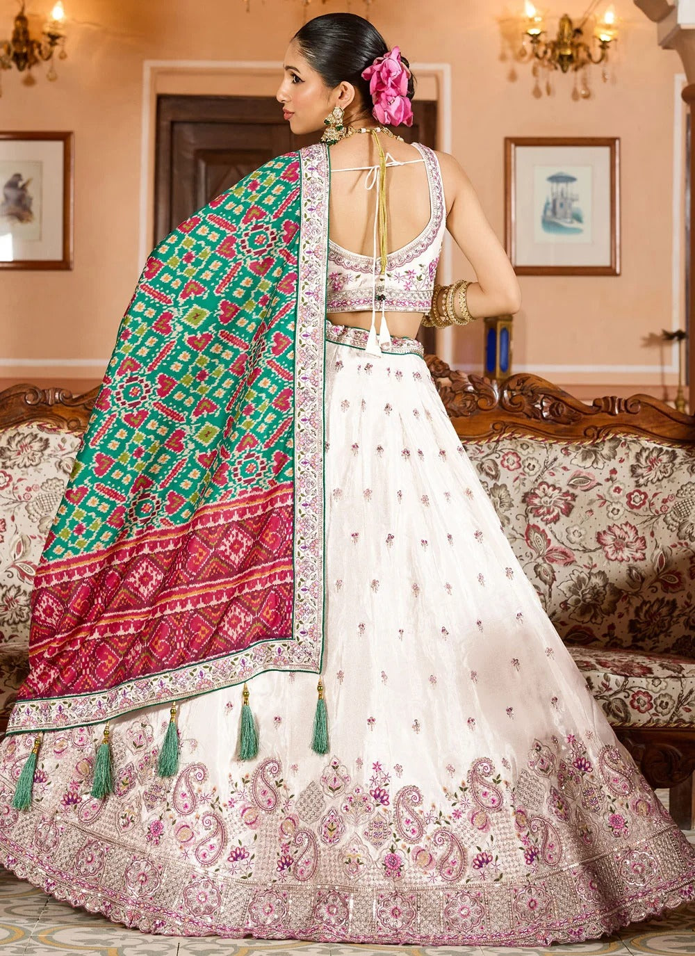 Exquisite cream engagement lehenga in tissue with patola dupatta zari embroidery