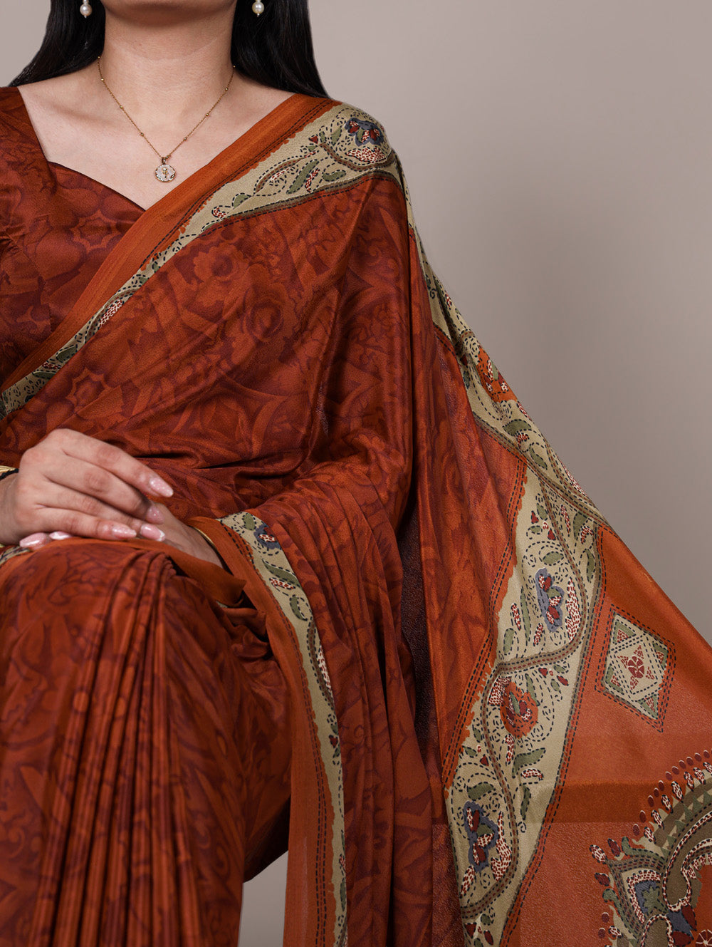 Rust orange crepe saree with all over print matching blouse