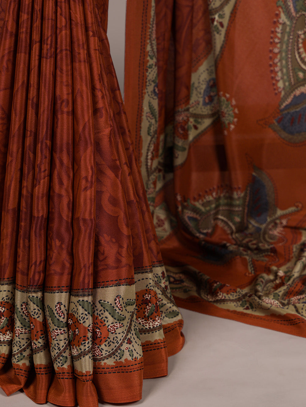 Rust orange crepe saree with all over print matching blouse