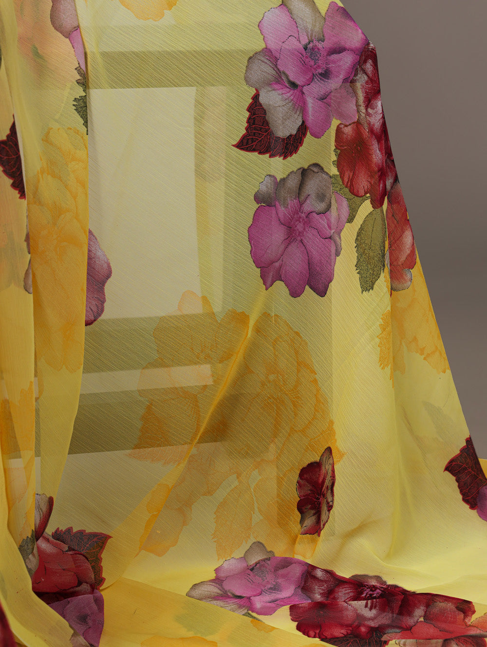 Yellow floral print chiffon saree with red banglory blouse lace border