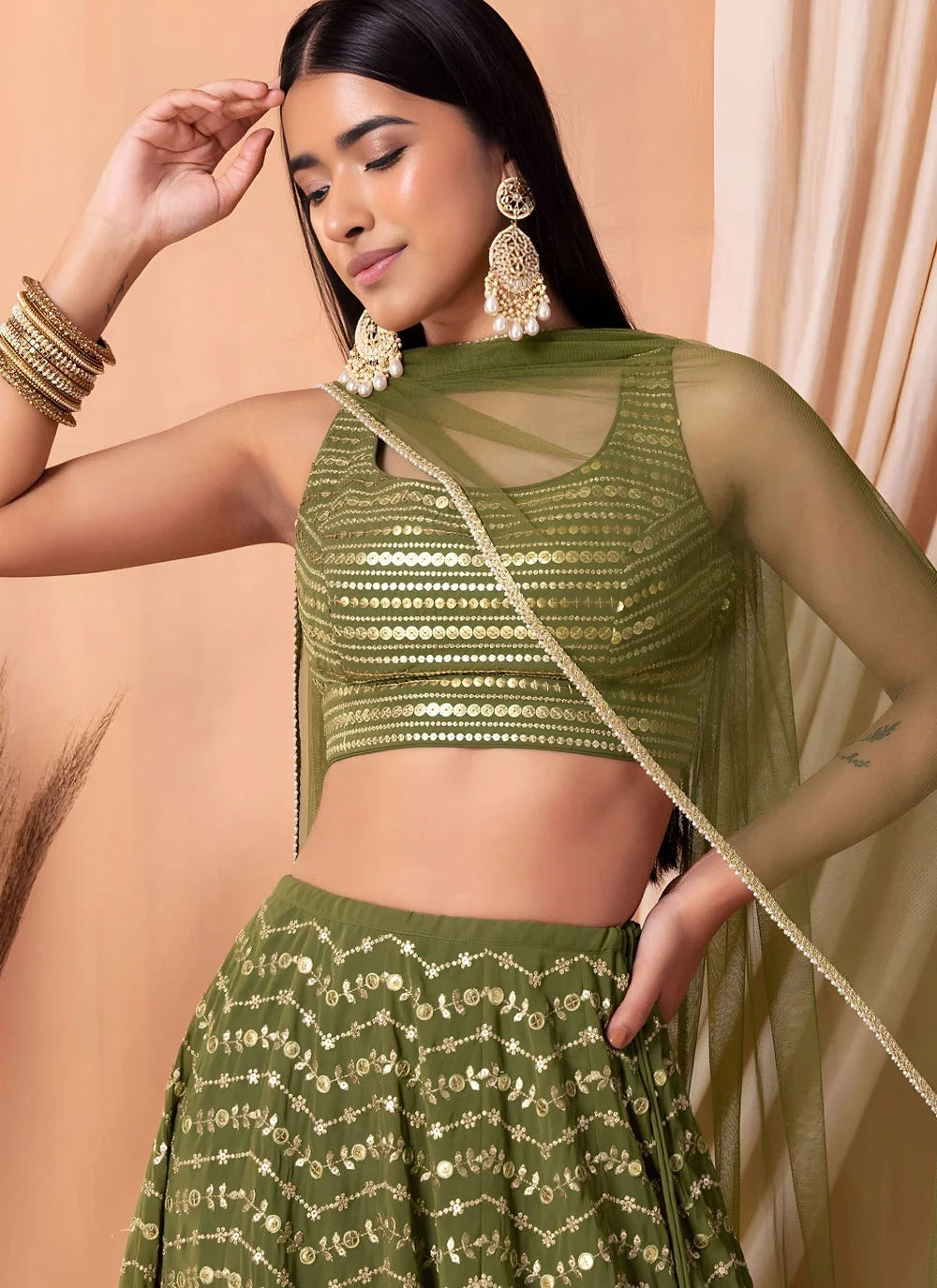Emerald green engagement lehenga in georgette with sequins embroidery
