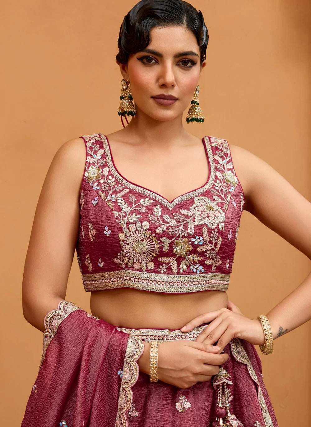 Opulent rosegold tissue lehenga with sequin stone embroidery
