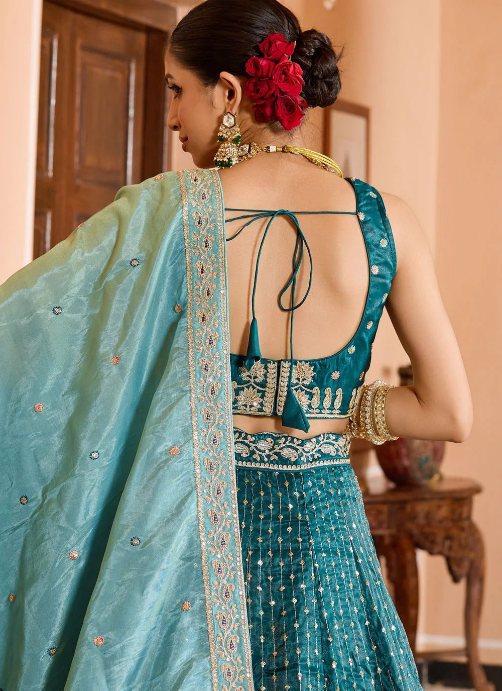 Luxury teal reception lehenga in tissue silk with zari sequins embroidery