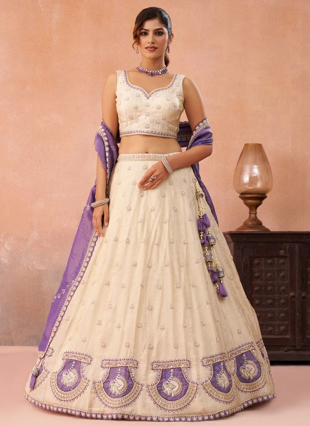 Purple designer wedding lehenga with peacock patch work