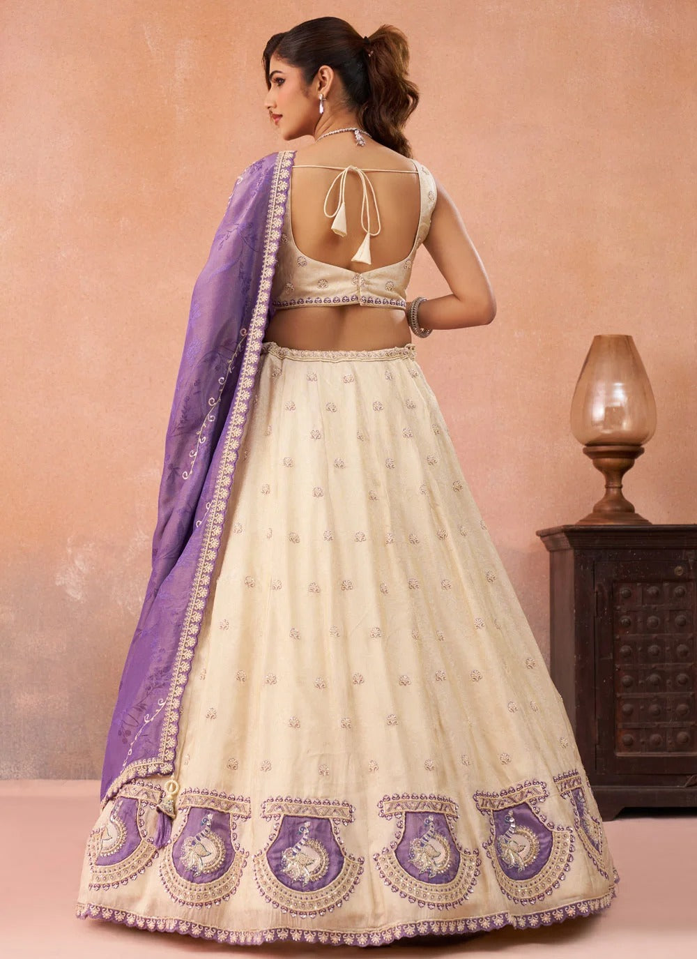 Purple designer wedding lehenga with peacock patch work