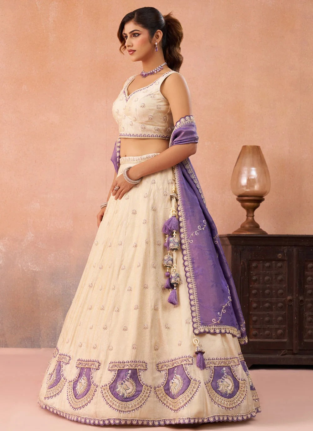 Purple designer wedding lehenga with peacock patch work