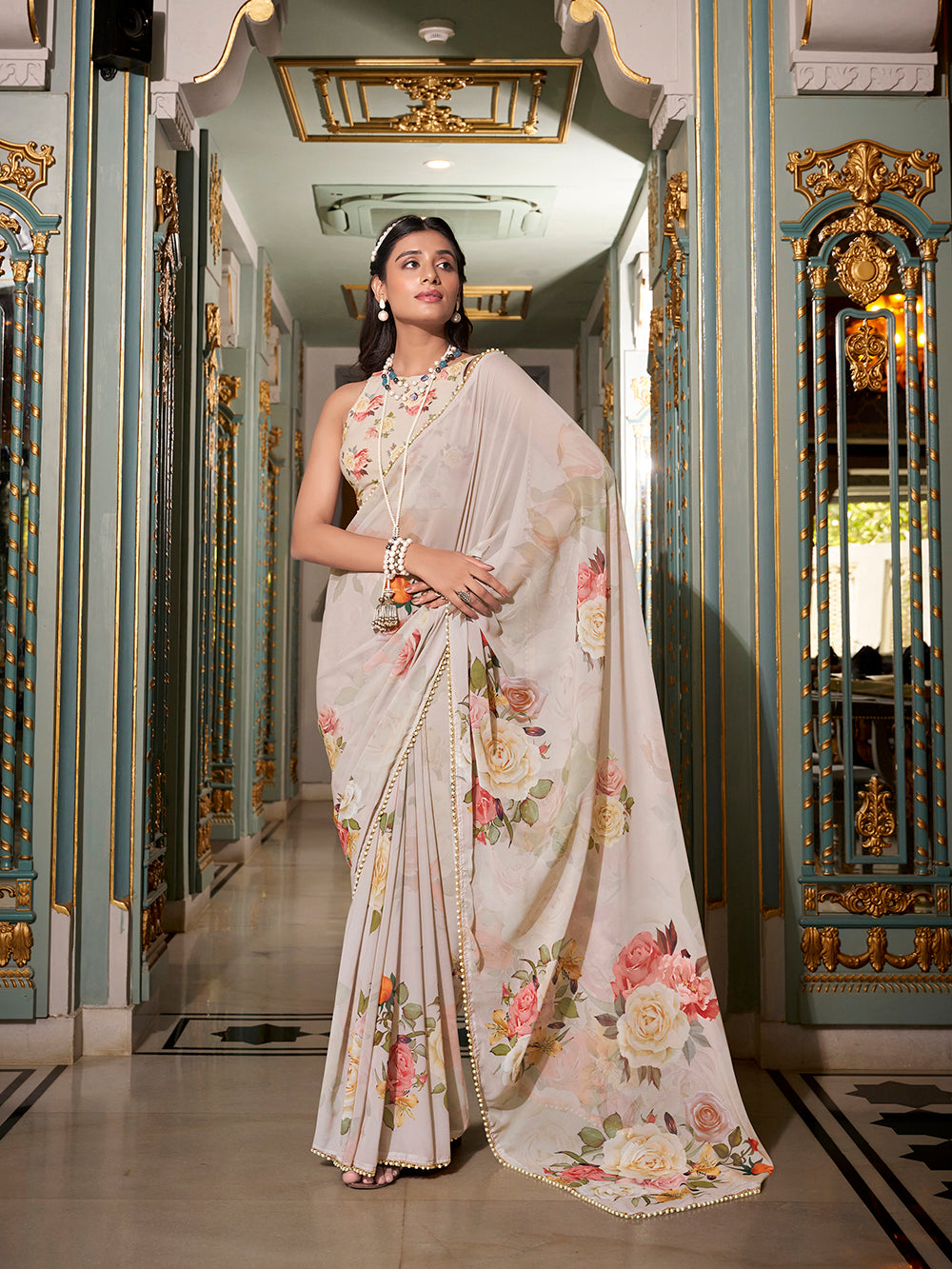 Off white georgette printed saree with pearl lace border