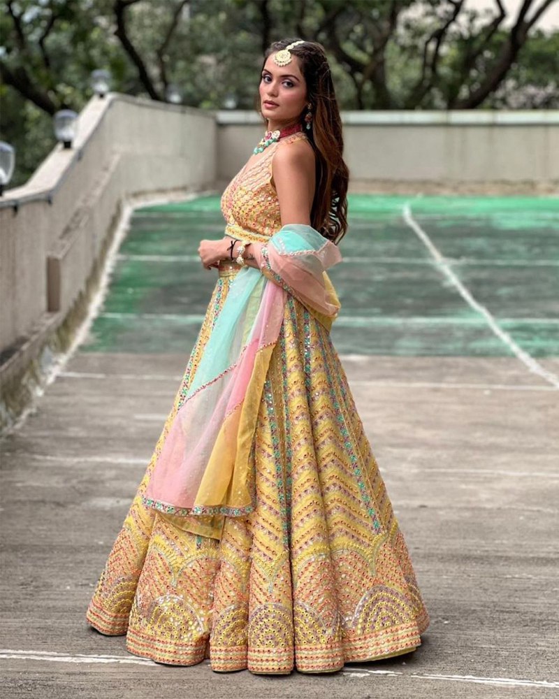 Dola Silk Yellow Lehenga Choli Set with Exquisite Sequined Embroidery