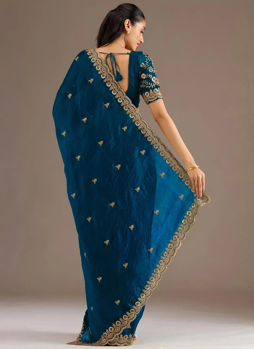 Ethereal dove blue party wear tissue saree with sequins dori zari embroidery