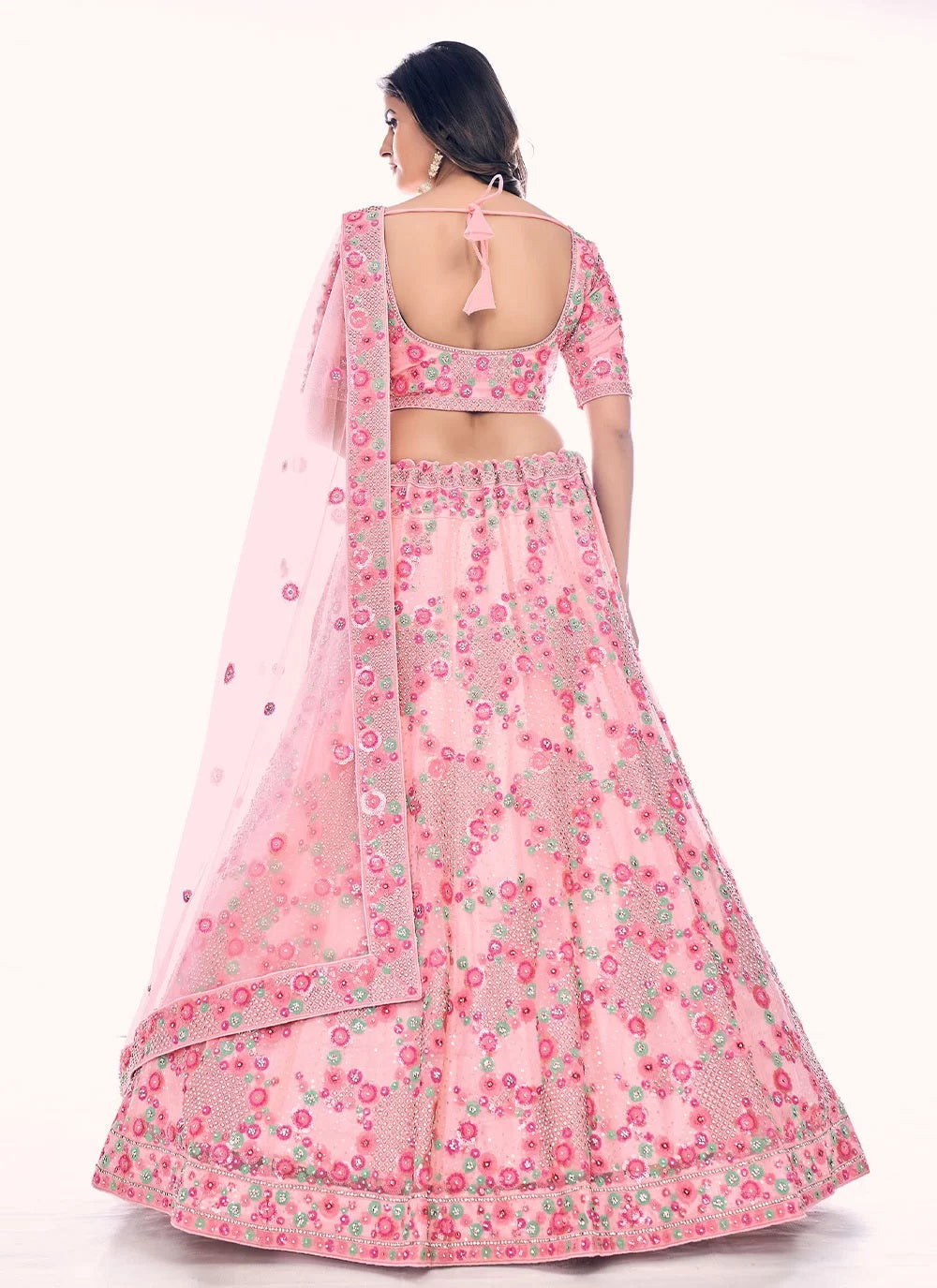 Elegant peach soft net lehenga with zarkan and thread work