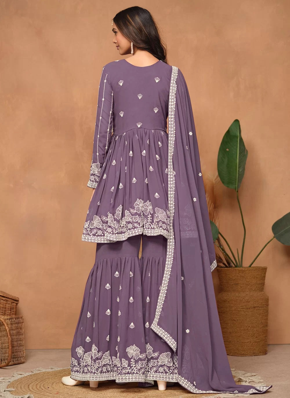 Elegant purple embroidered sharara style suit in faux georgette