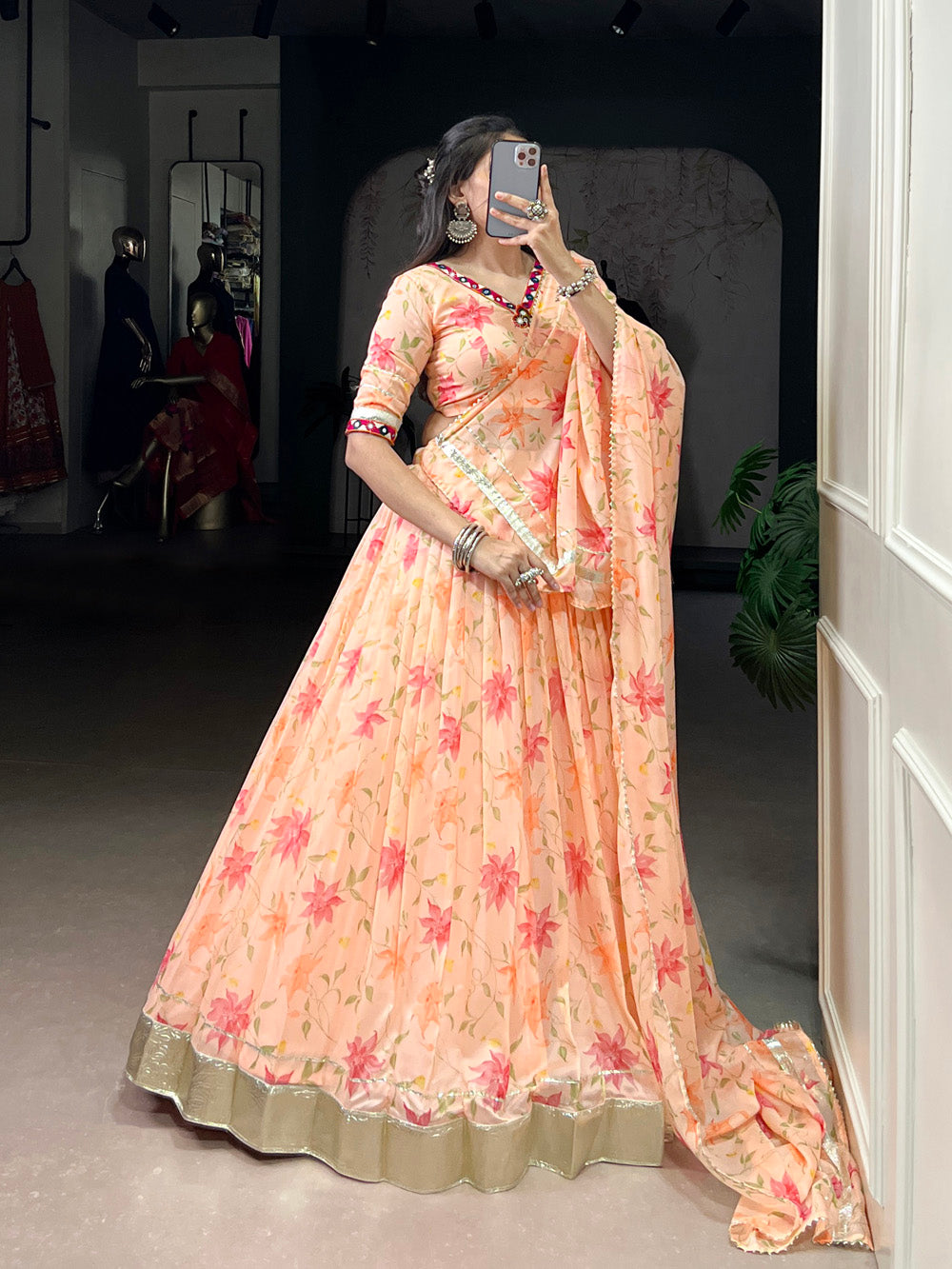 Peach tubby silk floral printed lehenga choli with embossed lace mirror work