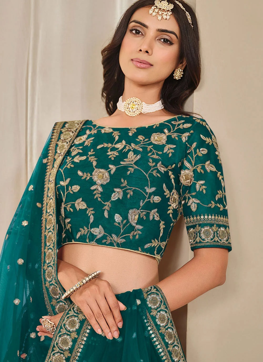 Elegant teal bridesmaid lehenga in art silk with embroidered net dupatta