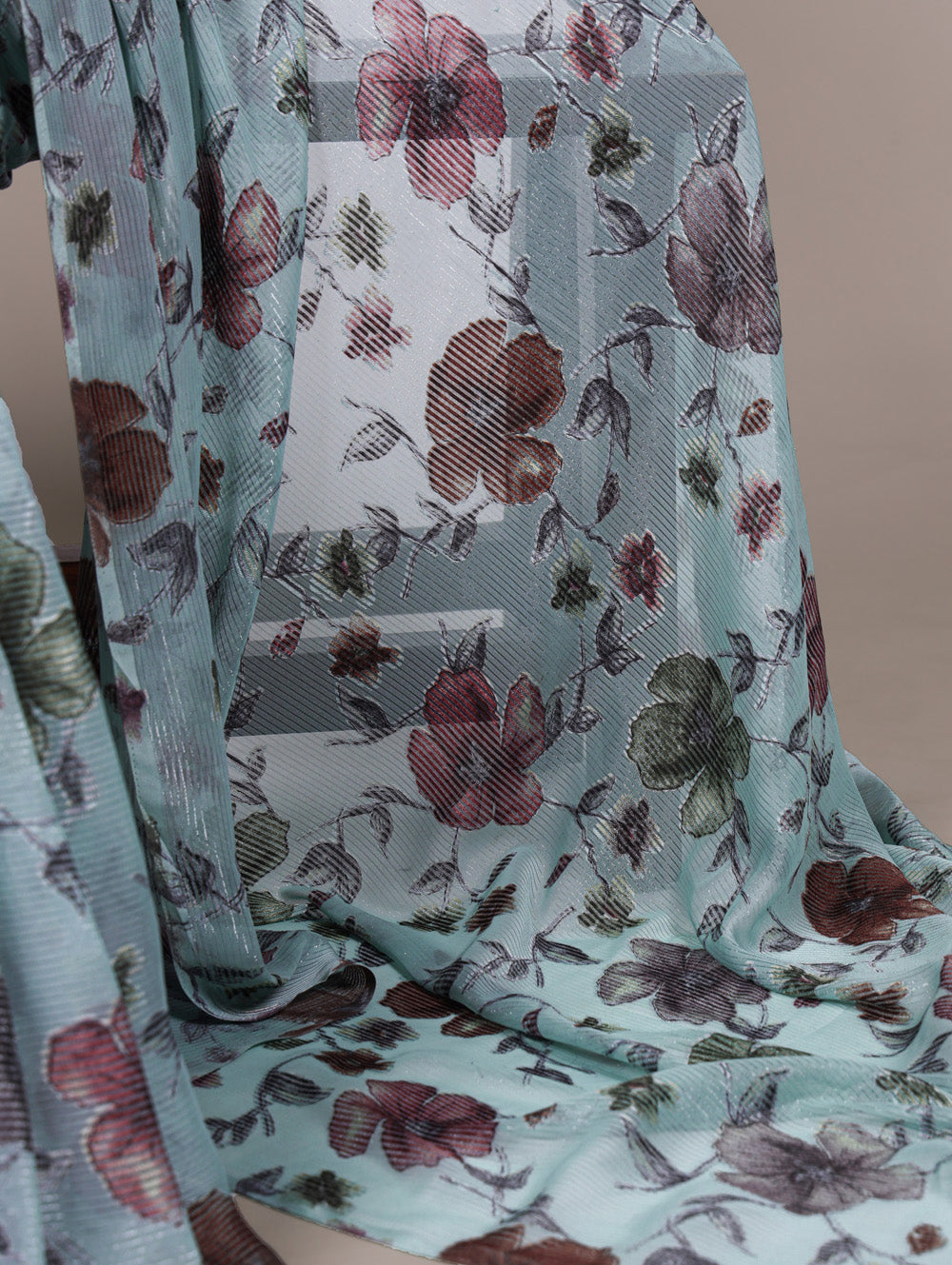 Sea green floral lurex brasso saree with natural silk blouse