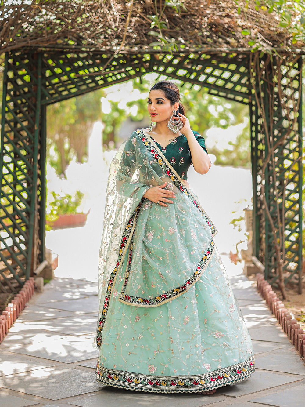 Pista Color Thread Embroidery Work With Lace Border Organza Lehenga Choli