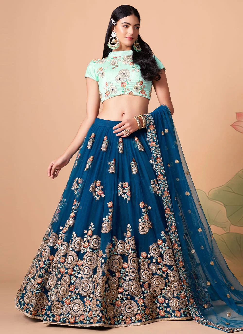 Exquisite net lehenga with floral thread embroidery and mirror work