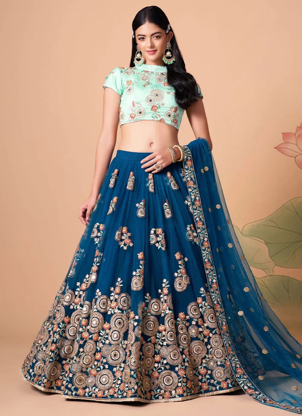 Exquisite net lehenga with floral thread embroidery and mirror work