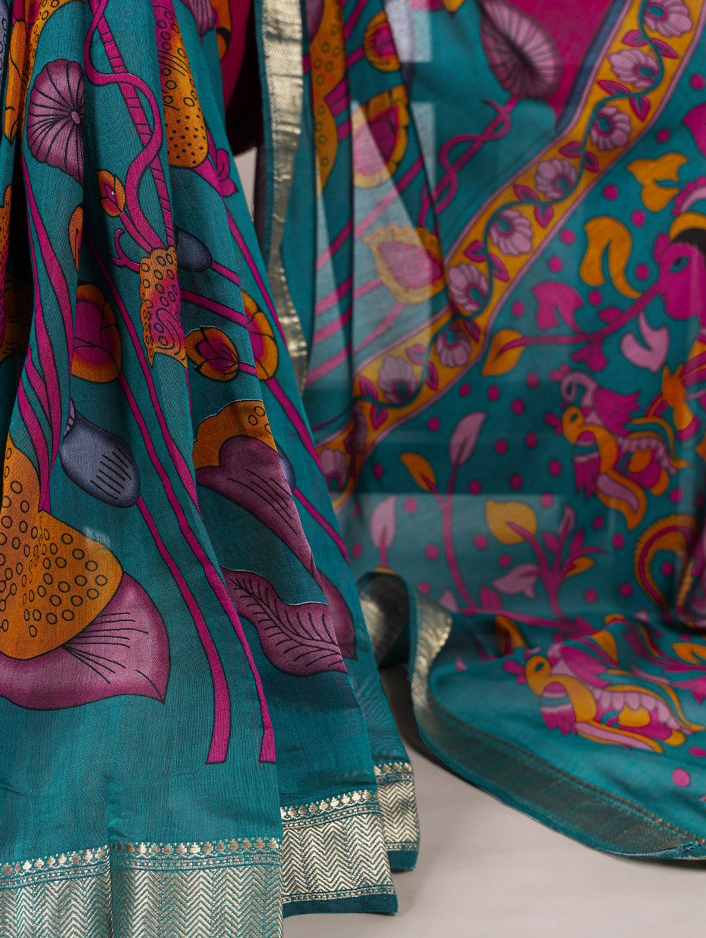 Teal floral printed viscose chanderi silk saree with zari weaving border
