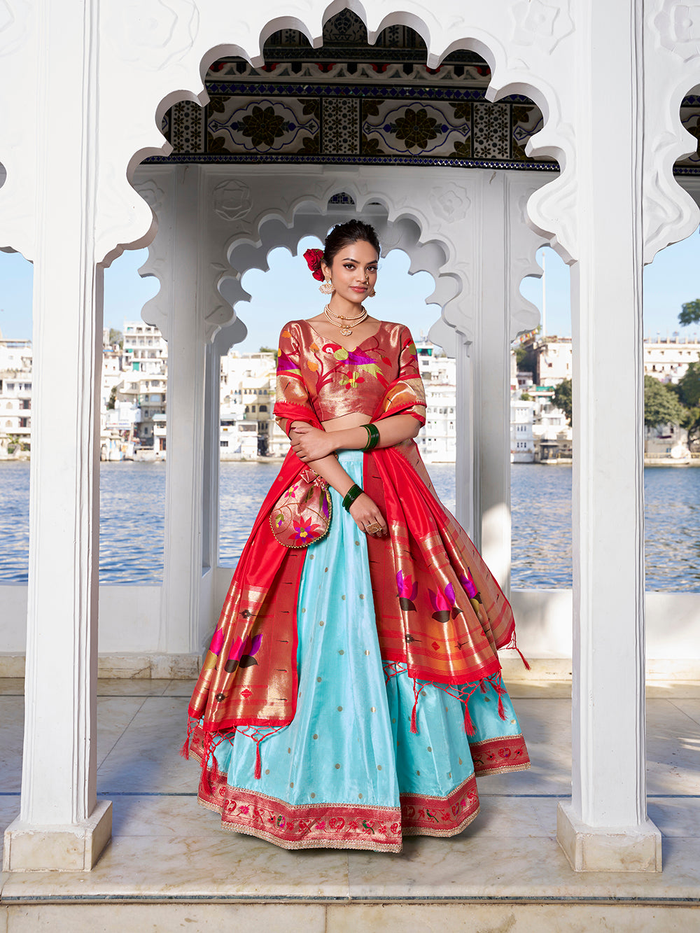 Sky blue jacquard silk lehenga choli with zari weaving matching potli purse