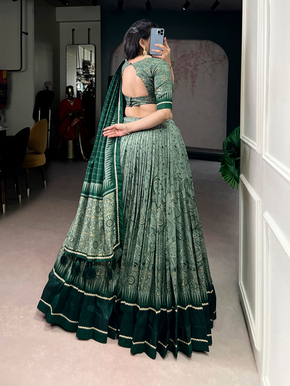 Green tasar silk kalamkari print lehenga choli with lace border tassel dupatta