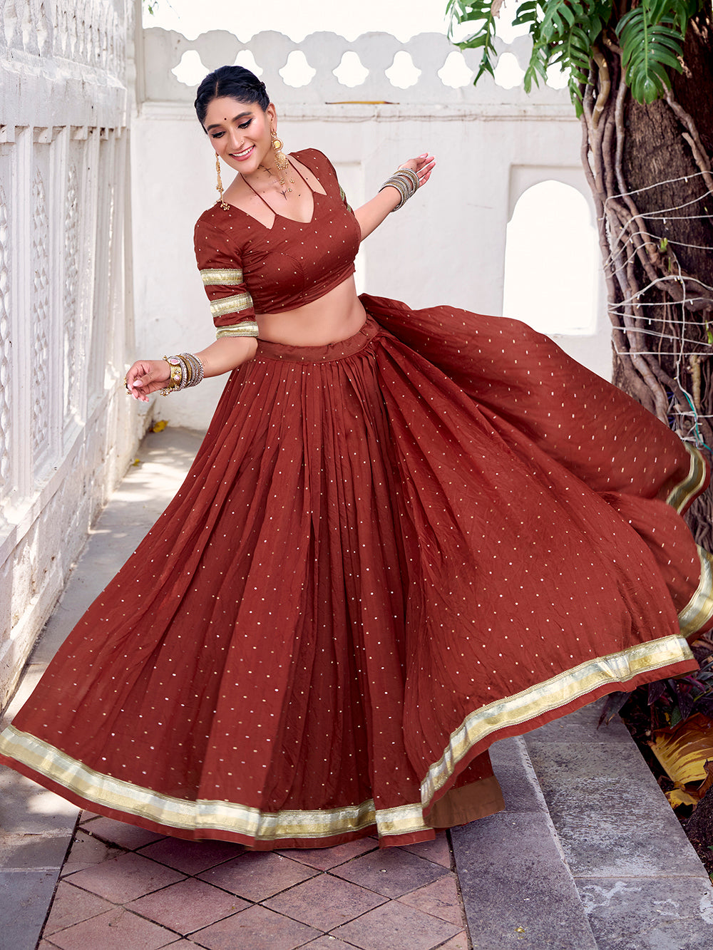 Rust orange chanderi zari weaving lehenga choli with embossed lace dupatta
