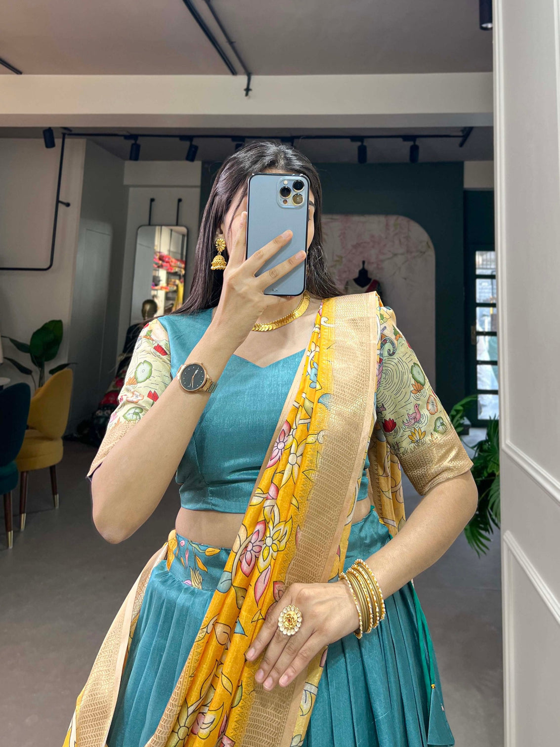 Alluring Firozi Dola Silk Lehenga Choli with Enchanting Kalamkari Prints