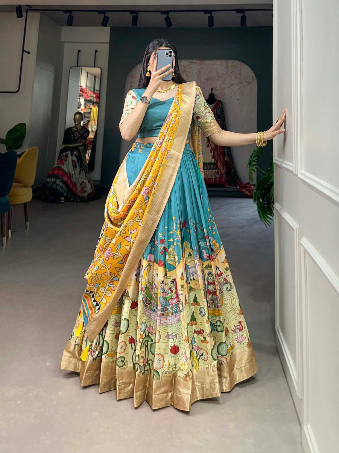 Alluring Firozi Dola Silk Lehenga Choli with Enchanting Kalamkari Prints