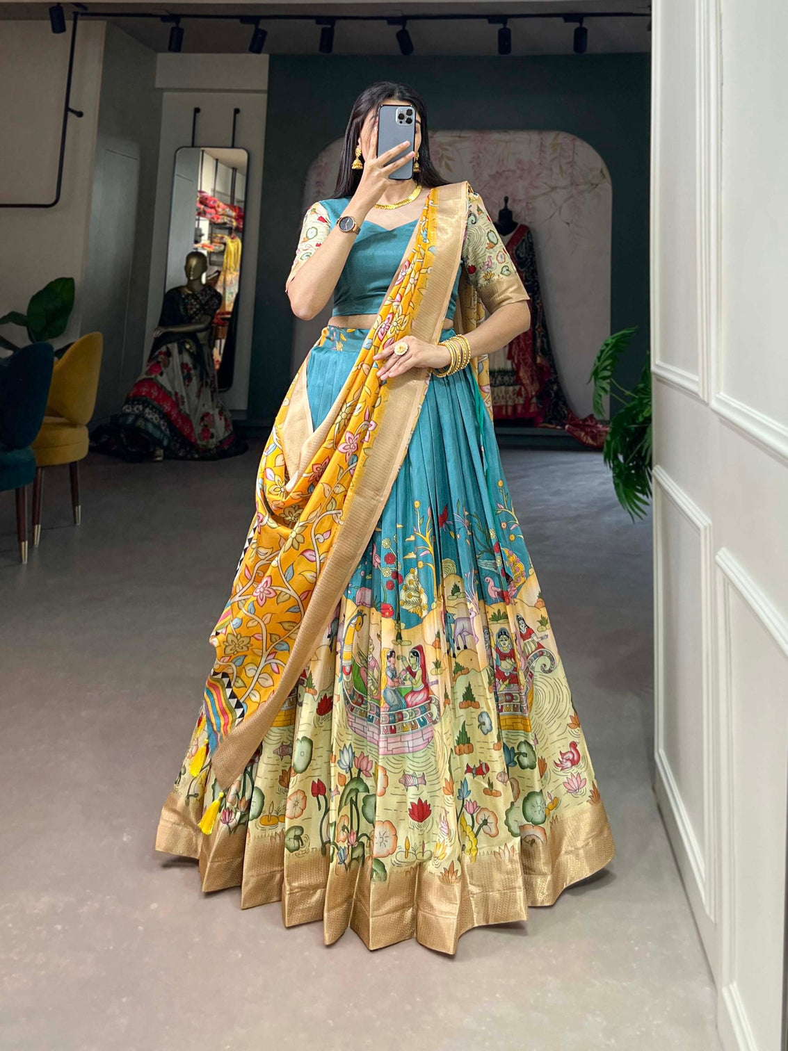 Alluring Firozi Dola Silk Lehenga Choli with Enchanting Kalamkari Prints