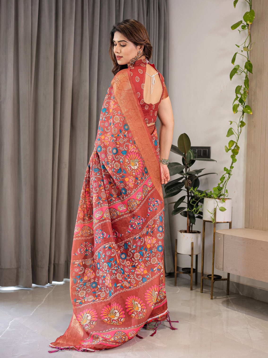 Graceful rust orange floral cotton linen saree with zari border tassels