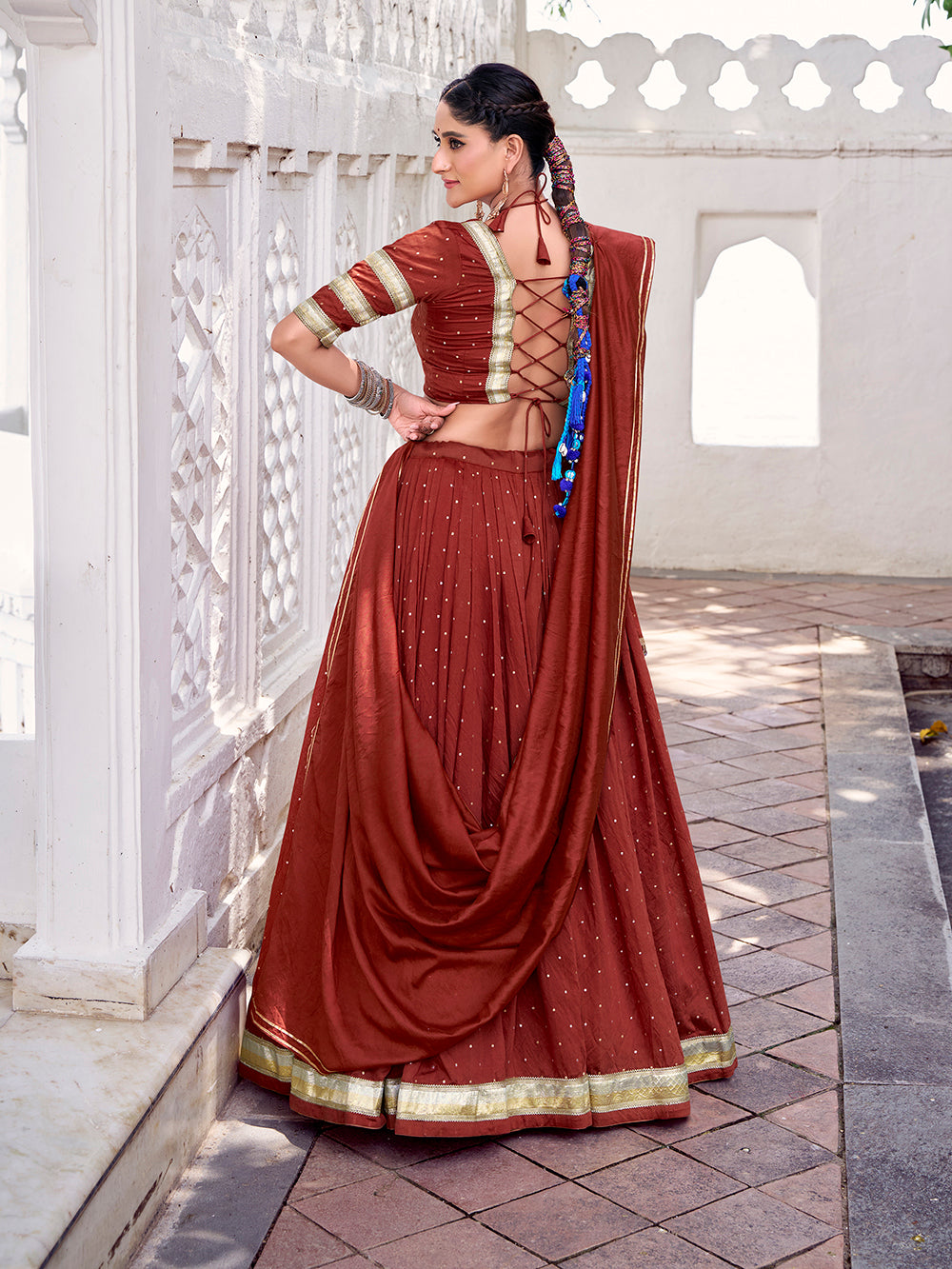 Rust orange chanderi zari weaving lehenga choli with embossed lace dupatta