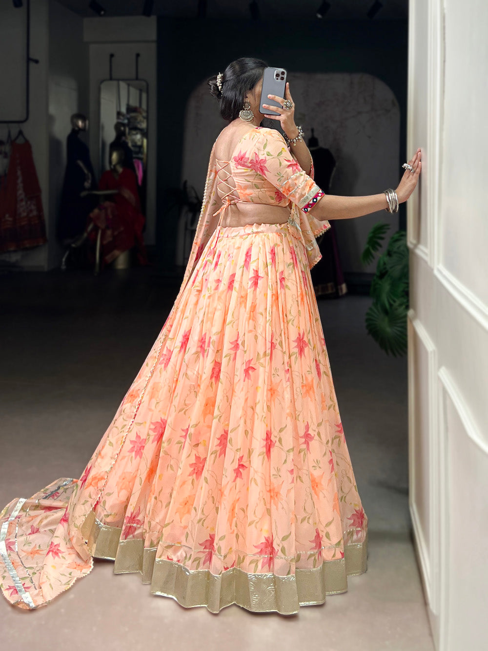 Peach tubby silk floral printed lehenga choli with embossed lace mirror work